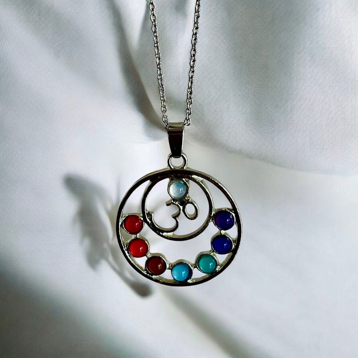 OM pendant on 26 inch stainless steel chain